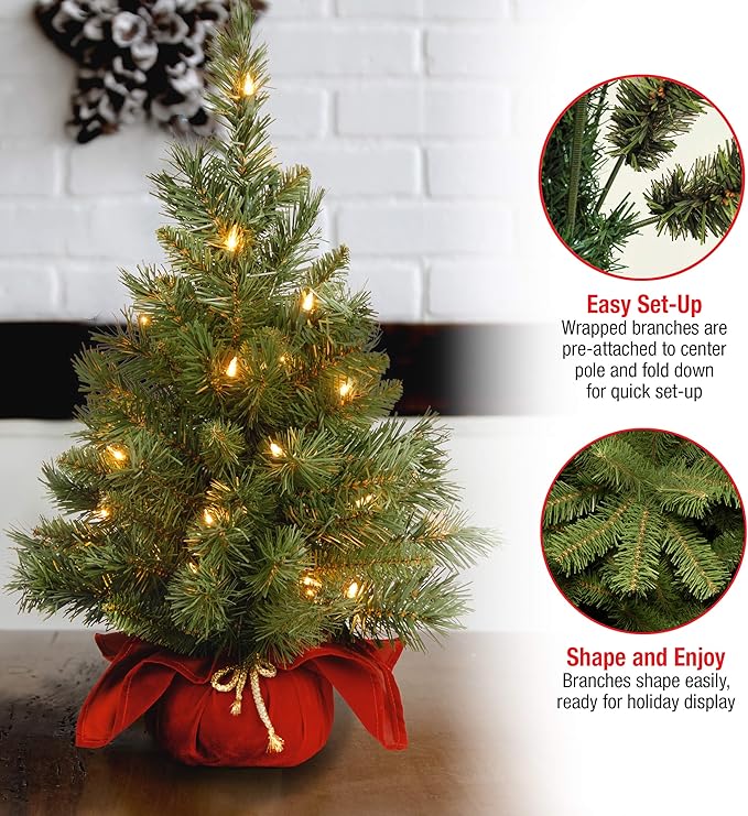 National Tree Company 24 in Pre-Lit Majestic Fir Mini Artificial Christmas Tree, 35 Clear Lights, 71 Tips, Red Cloth Base, Green