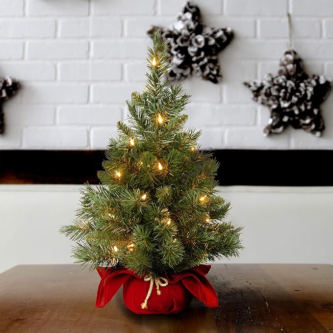 National Tree Company 24 in Pre-Lit Majestic Fir Mini Artificial Christmas Tree, 35 Clear Lights, 71 Tips, Red Cloth Base, Green